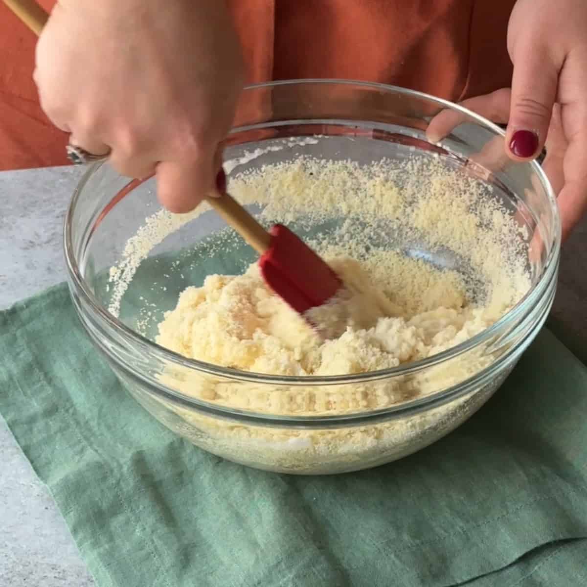 How to Make Amaretti Cookies add almond extract to dry ingredient and fold in egg whites to form dough