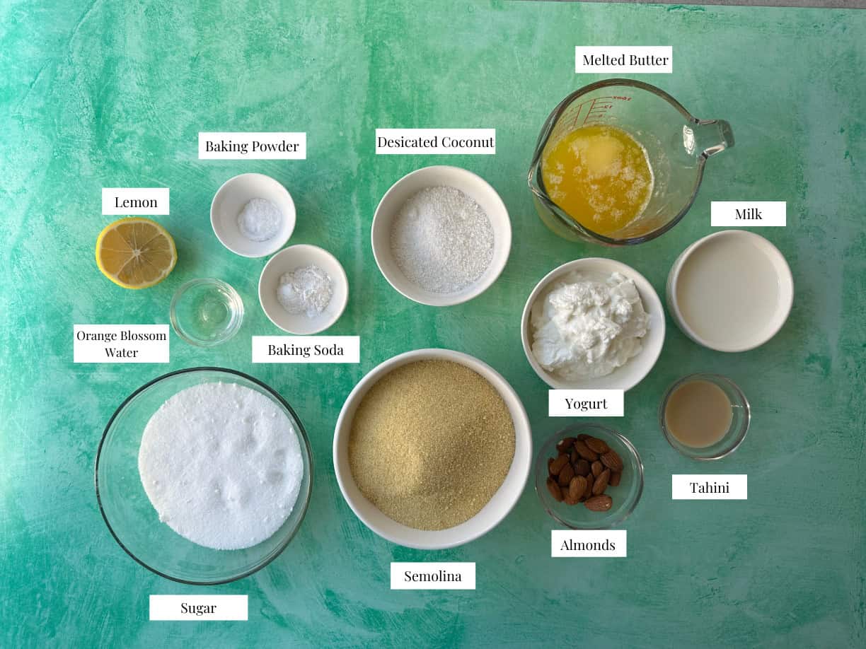 ingredients to make basbousa are semolina, sugar, yogurt, butter, coconut, baking powder and baking soda.