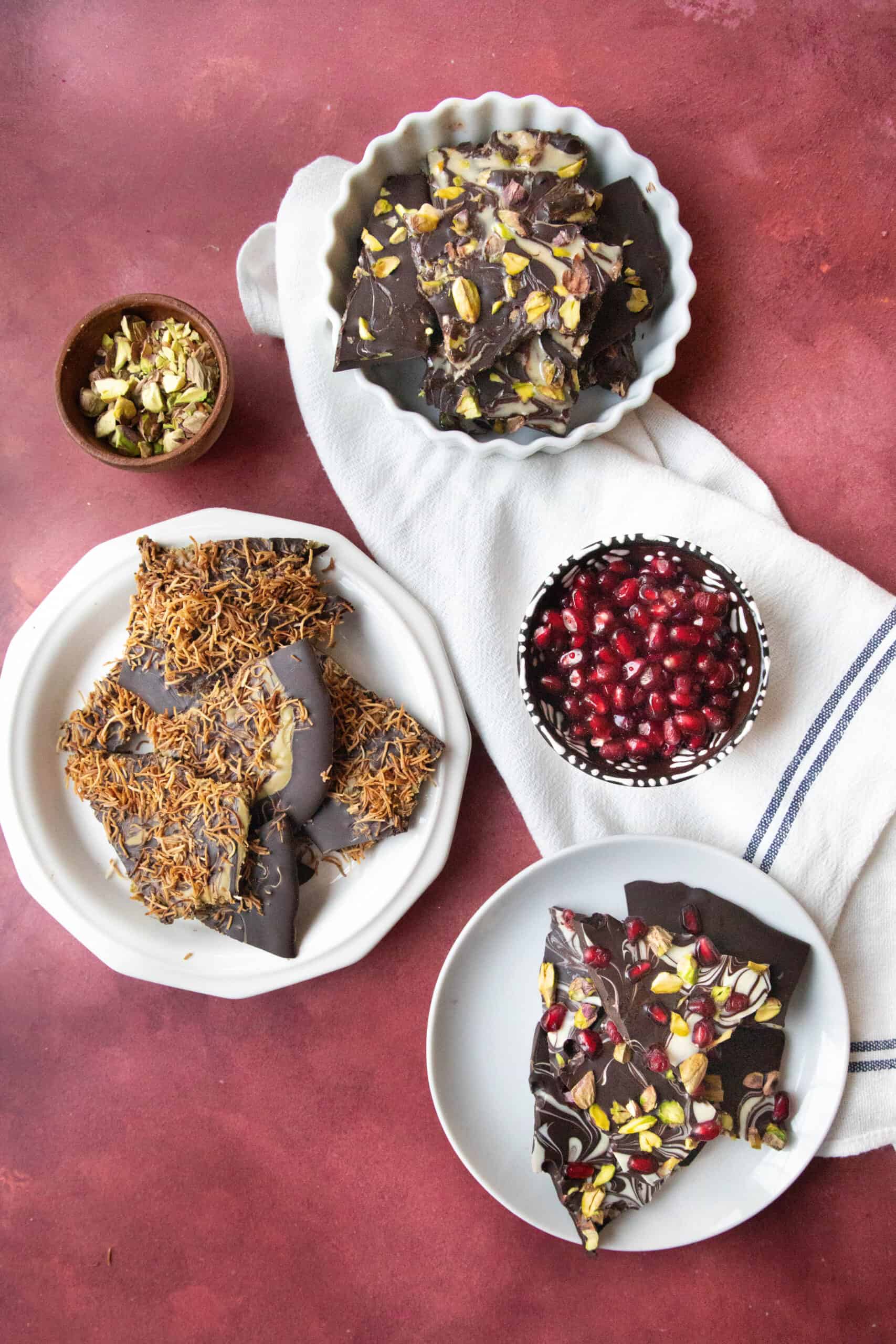Chocolate Bark with Pomegranates Three flavors of chocolate bark, kataifi and pistachio spread, tahini and pistachios, and pomegranate pistachio.