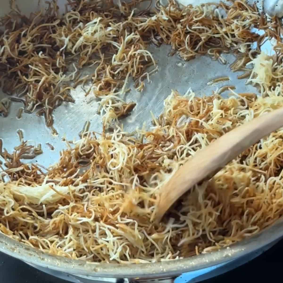 Cooking kataifi dough. The dough turned golden brown.