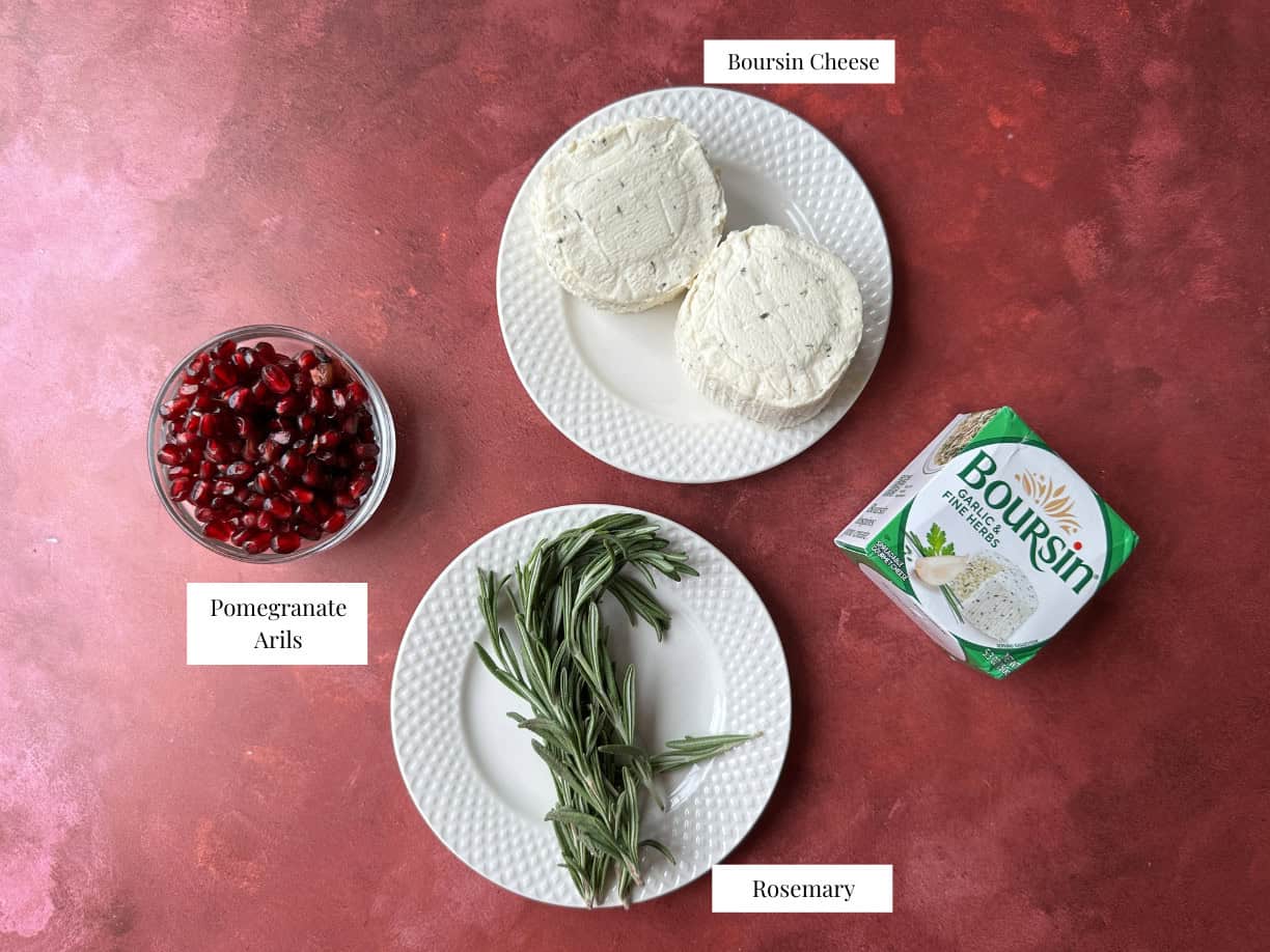 Christmas Tree Cheese Ball Ingredients Christmas tree cheese ball ingredients including Boursin cheese, rosemary sprigs, and pomegranate arils