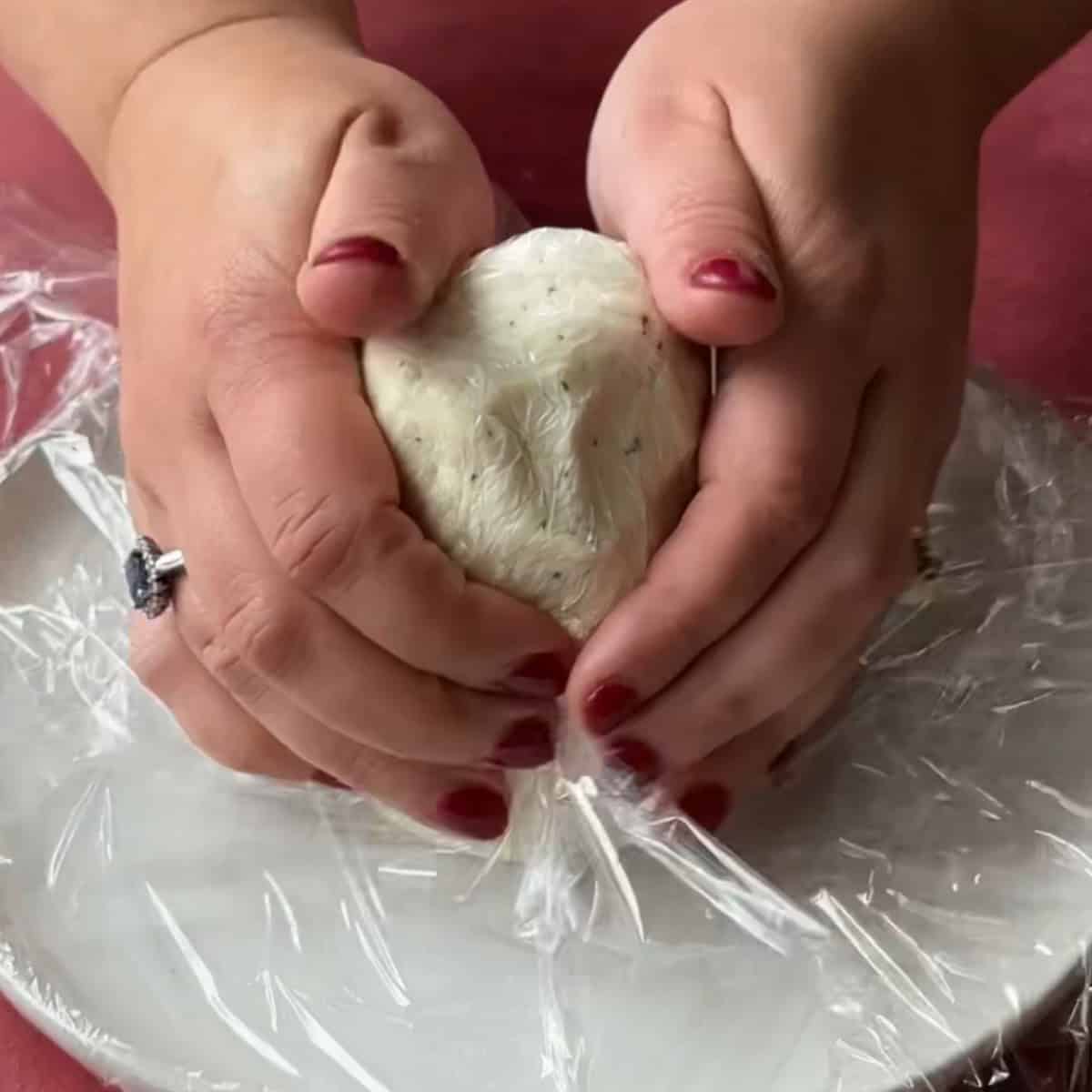 How to Make Christmas Cheese Ball start forming the cone shape of the tree with the cheese