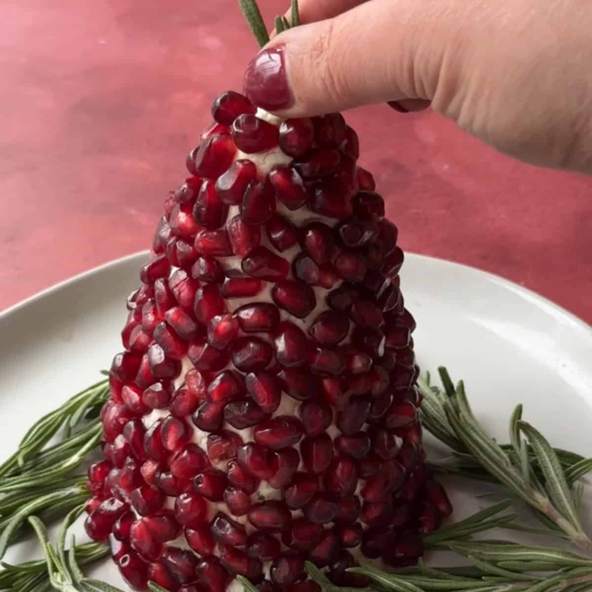 How to Make Christmas Tree Cheese Ball then add rosemary sprigs to the Christmas tree cheese ball