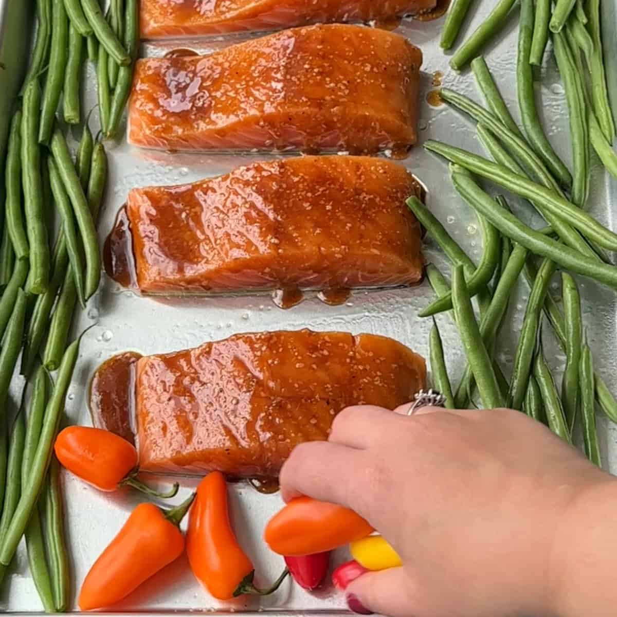 add the beans and peppers to the greased sheet pan