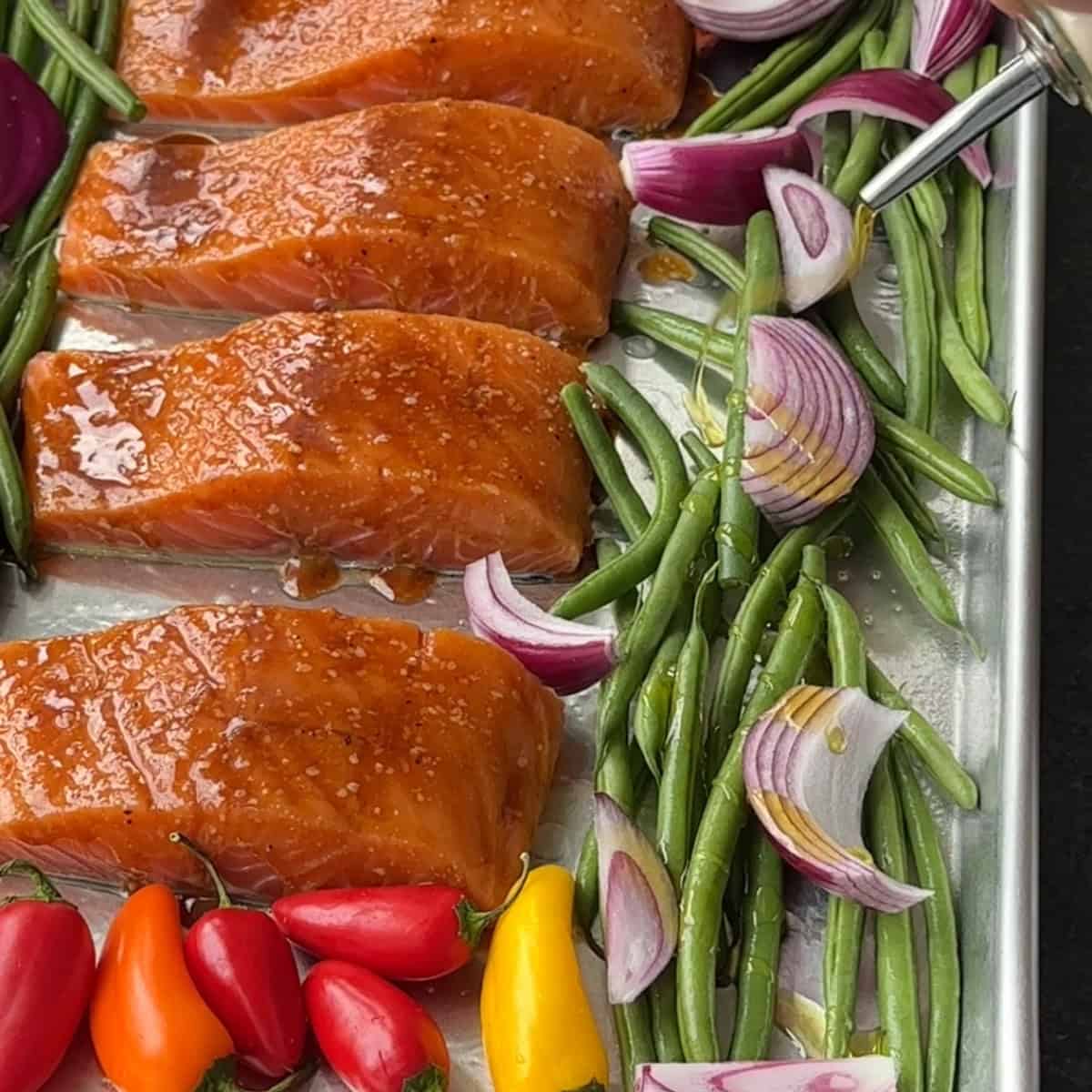 add the red onions with the other veggies on the sheet pan with salmon