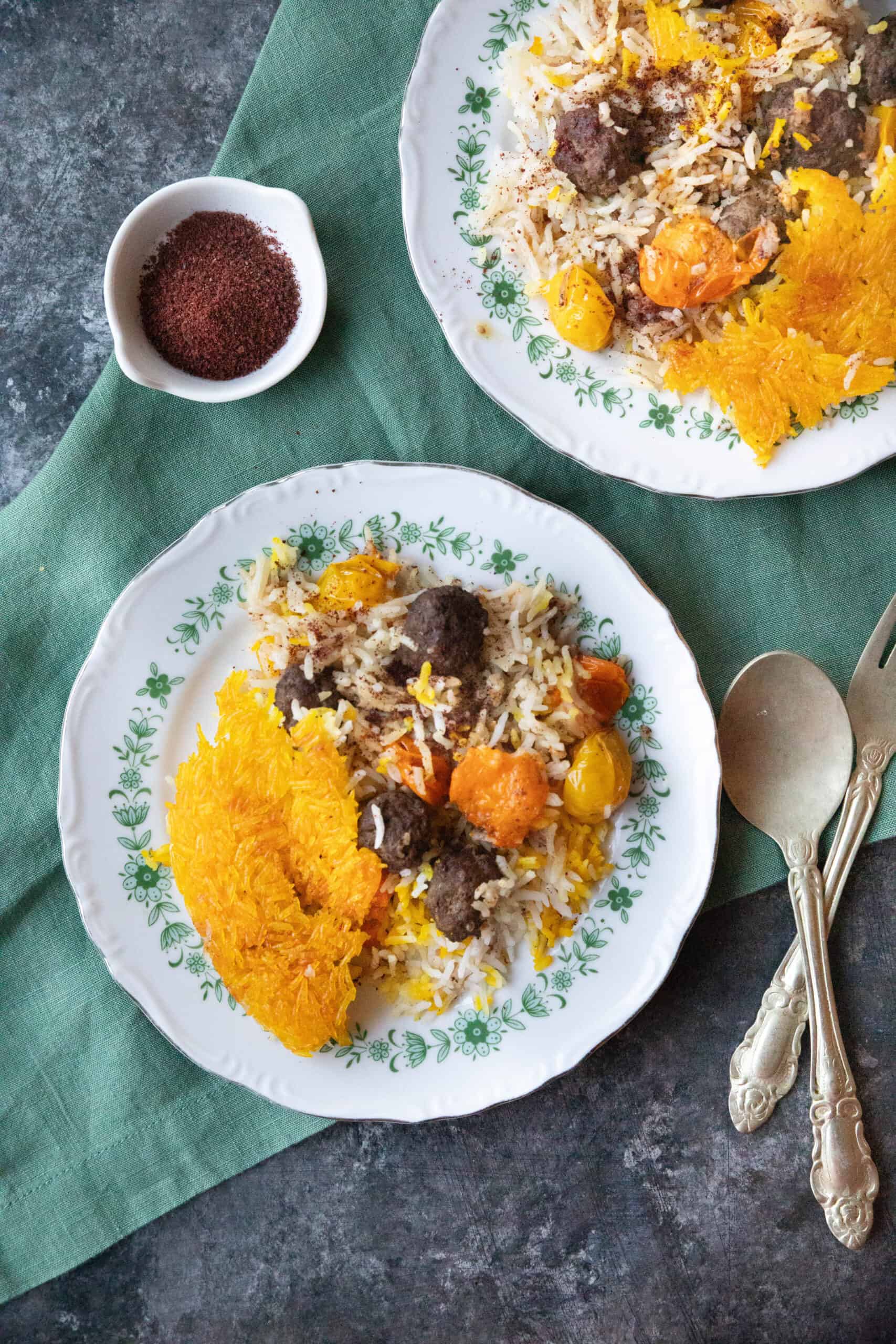 A plate of Persian sumac rice with meatballs.