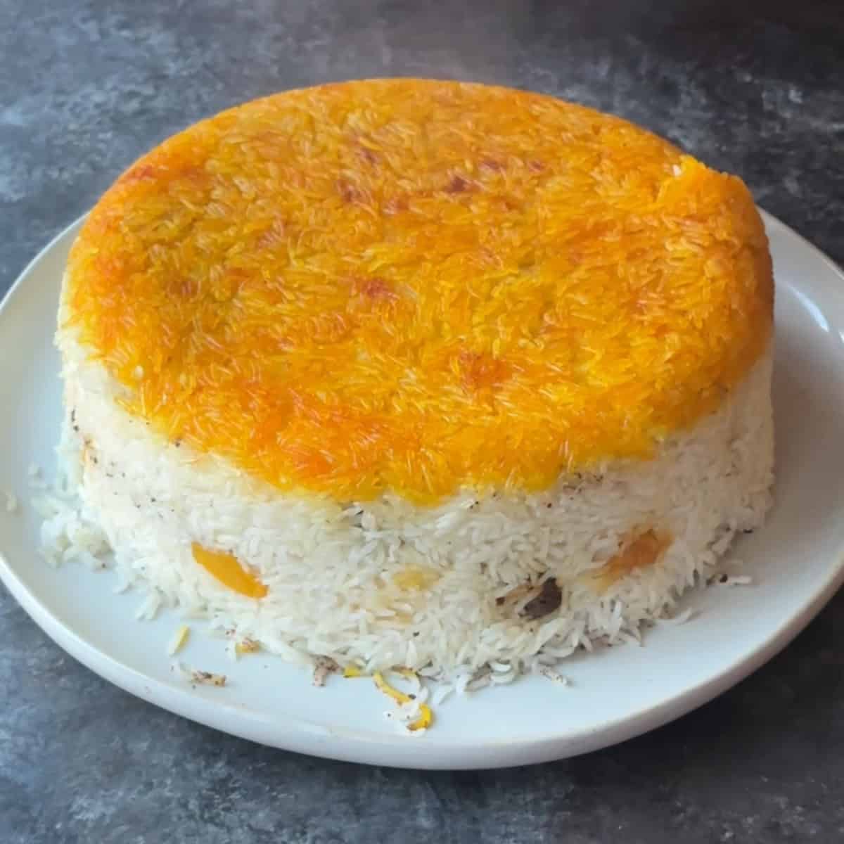 Flip the sumac polo onto a plate.