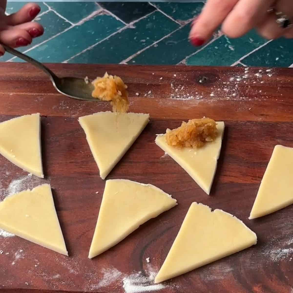 How to Make Turkish Apple Cookies add filling to wider side of cookie dough