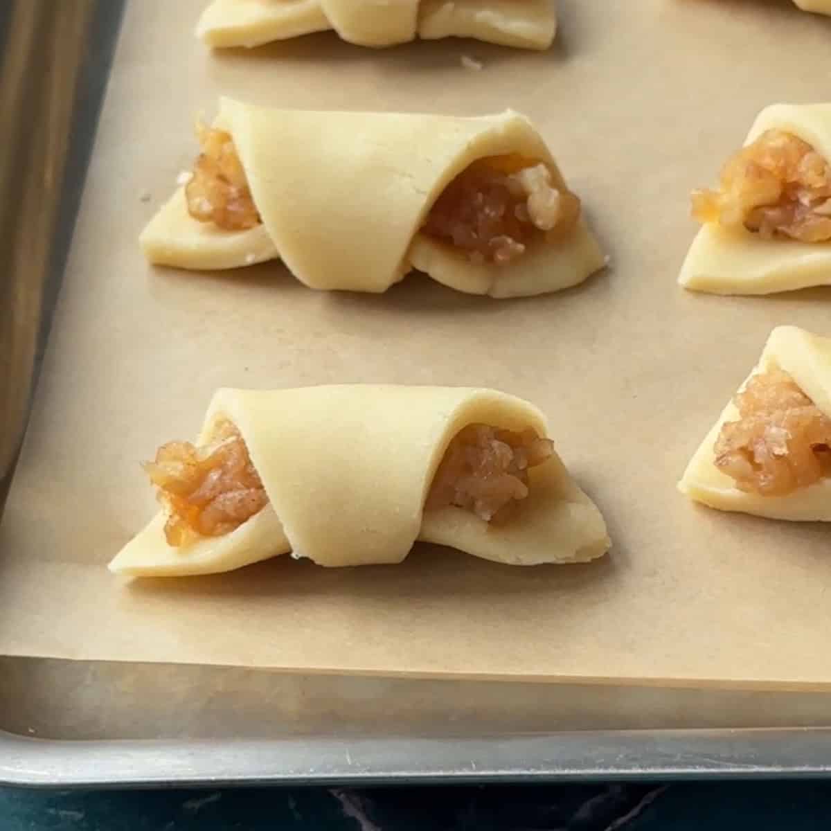 How to Make Turkish Apple Cookies place Turkish apple cookies onto baking sheet