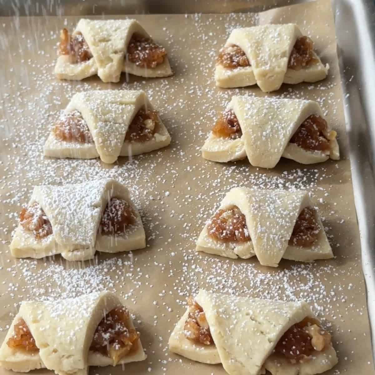 How to Make Turkish Apple Cookies bake, cool, then dust powdered sugar over final Turkish apple cookies