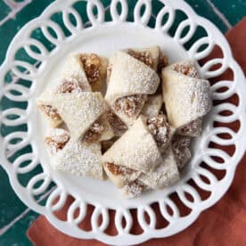 Turkish apple cookies served in white decorative dishes.