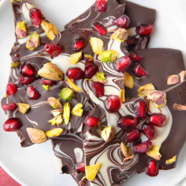 Three flavors of chocolate bark, kataifi and pistachio spread, tahini and pistachios, and pomegranate pistachio.