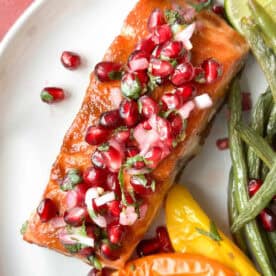 sheet pan salmon with pomegranate salsa on a plate.