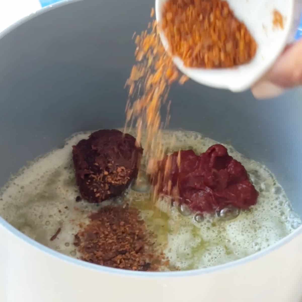 Butter tomato sauce for manti Add pul biber to the tomato sauce and pepper sauce