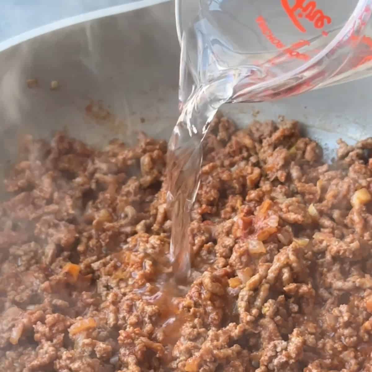 Easy Turkish Pasta Recipe Adding water to the meat sauce in order to simmer it