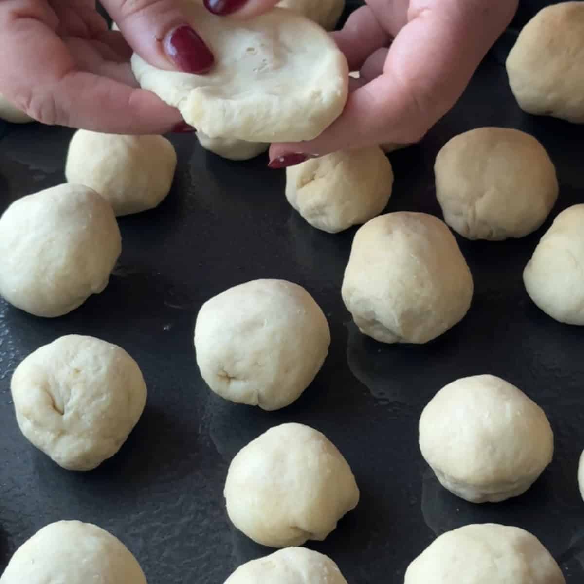 forming the dough into small round circles