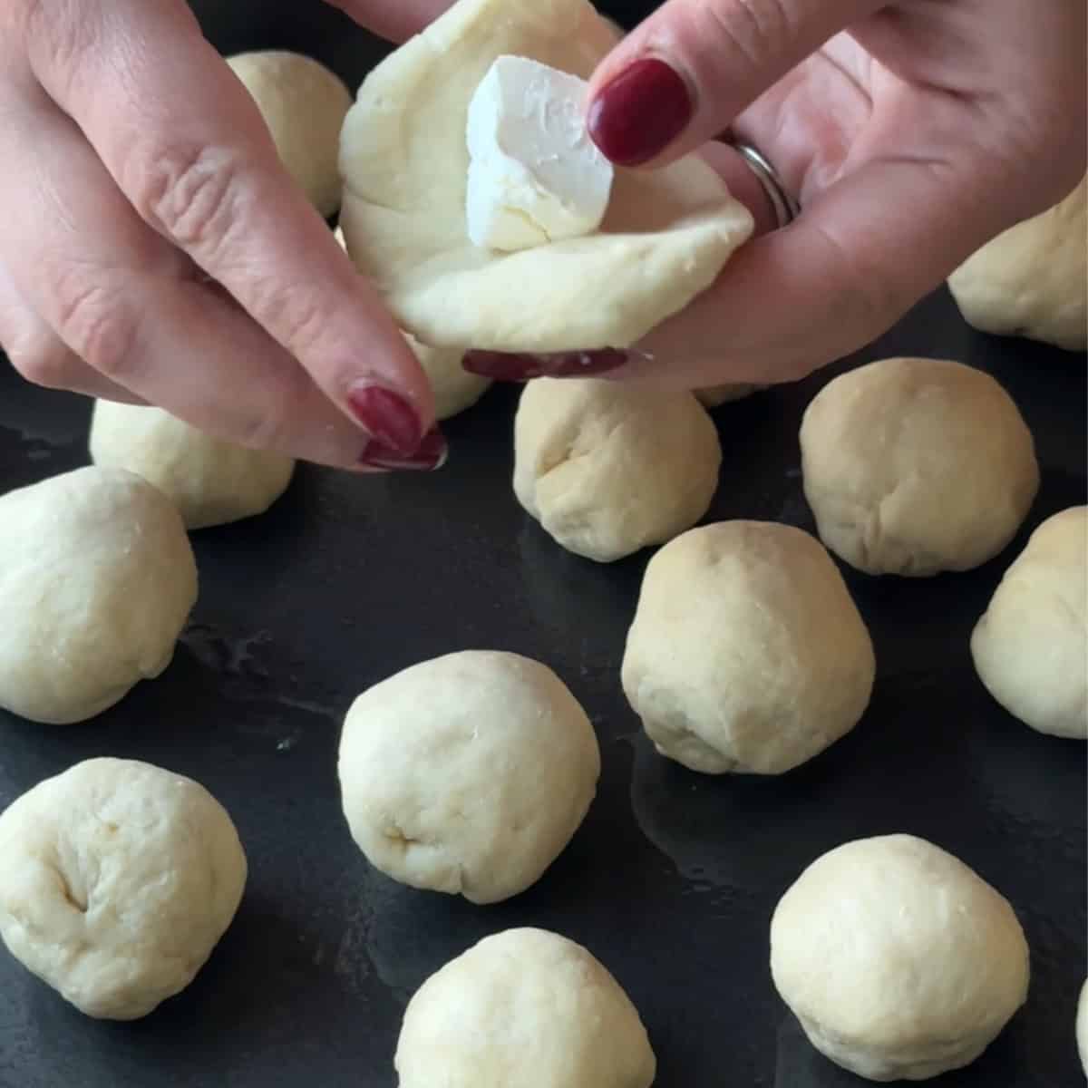 filling the dough with cream cheese
