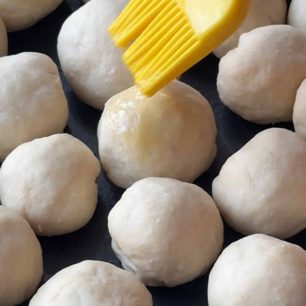 brushing the dough with egg wash