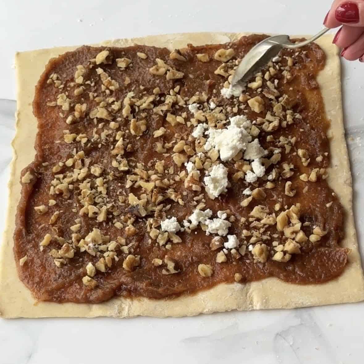 top with walnuts and goat cheese