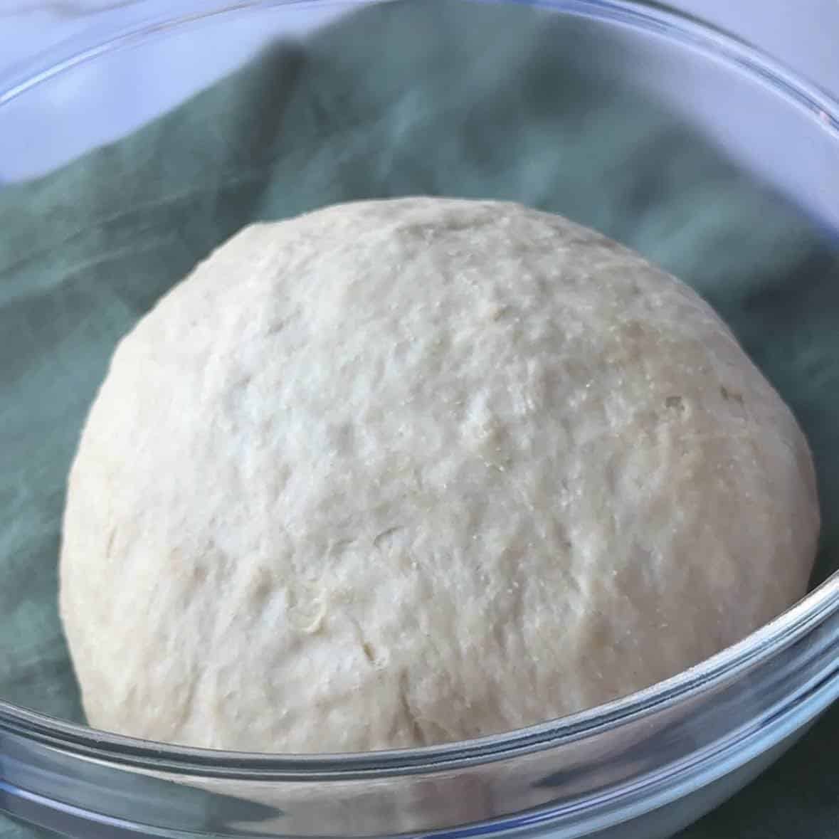 The dough has risen completely and has doubled in size.