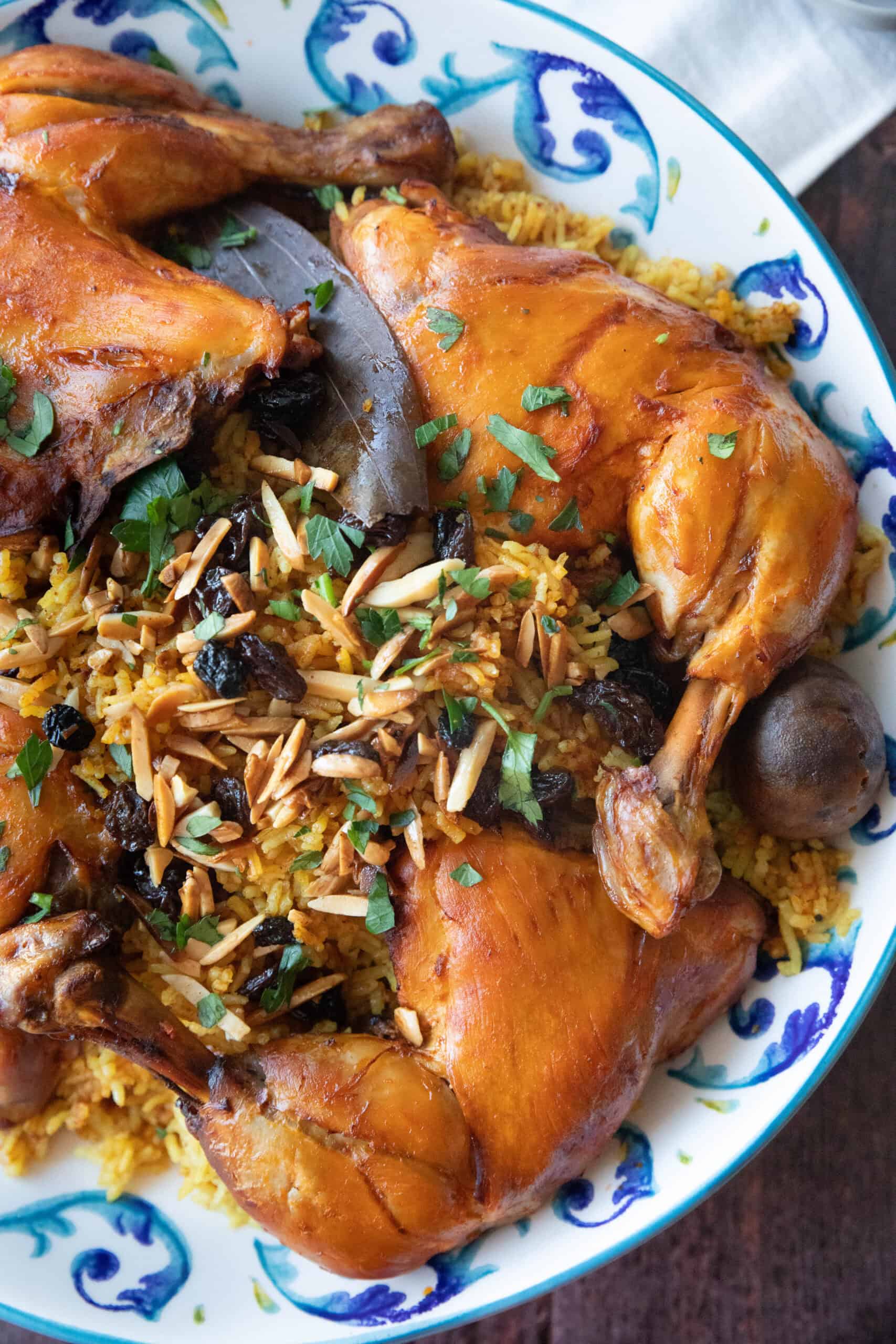 Step by Step Machboos Recipe machboos or Arabian Gulf kabsa chicken and rice served in a decorative platter with garnish