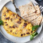 Date omelette on a plate with lavash.