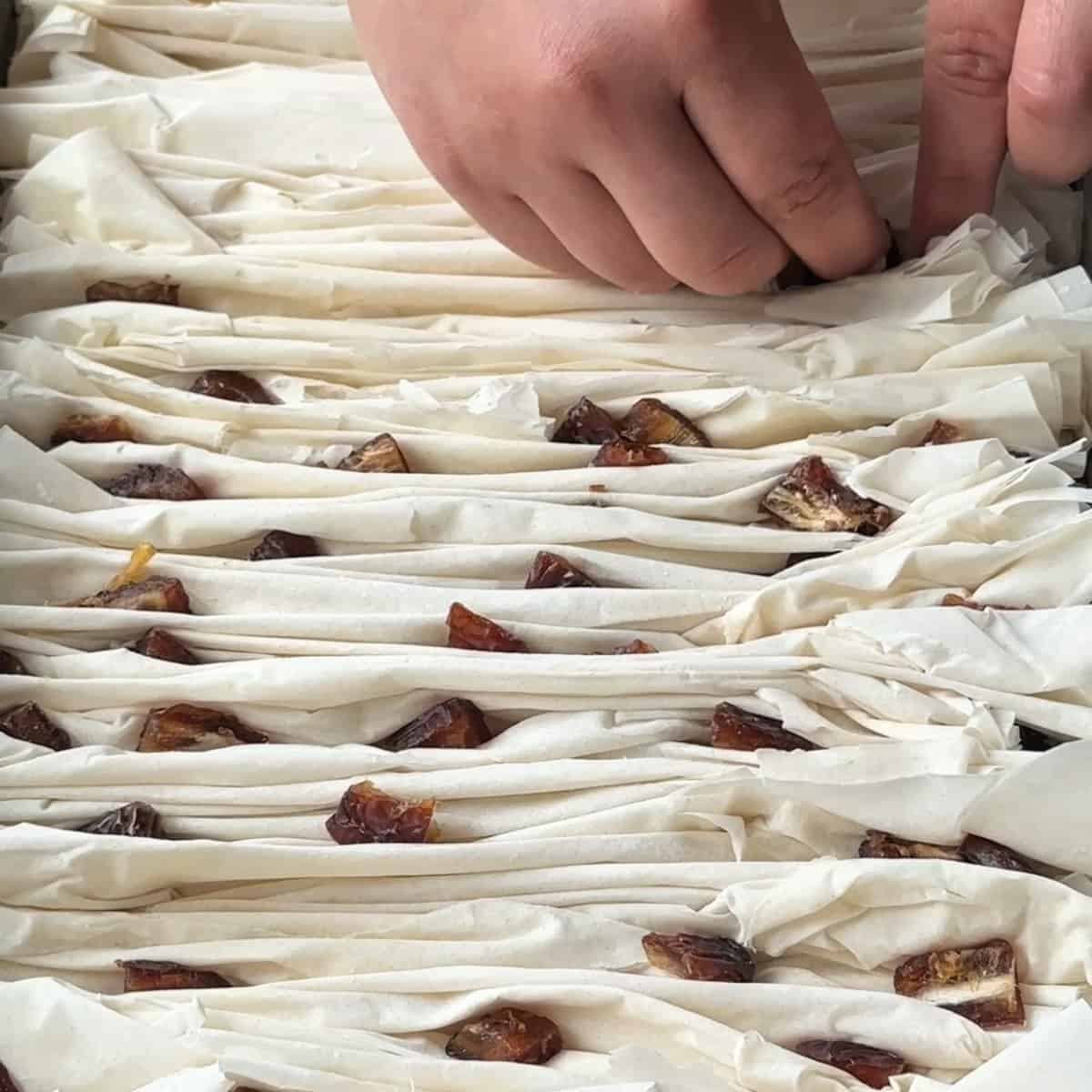 Fit in the dates in between the phyllo.