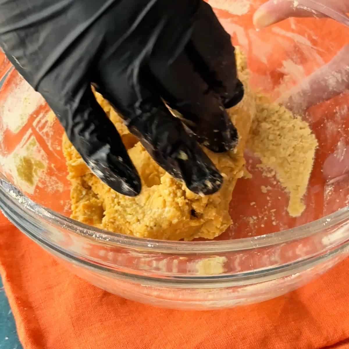 Nowruz Cookies mixing the chickpea flour cookies dough by hand