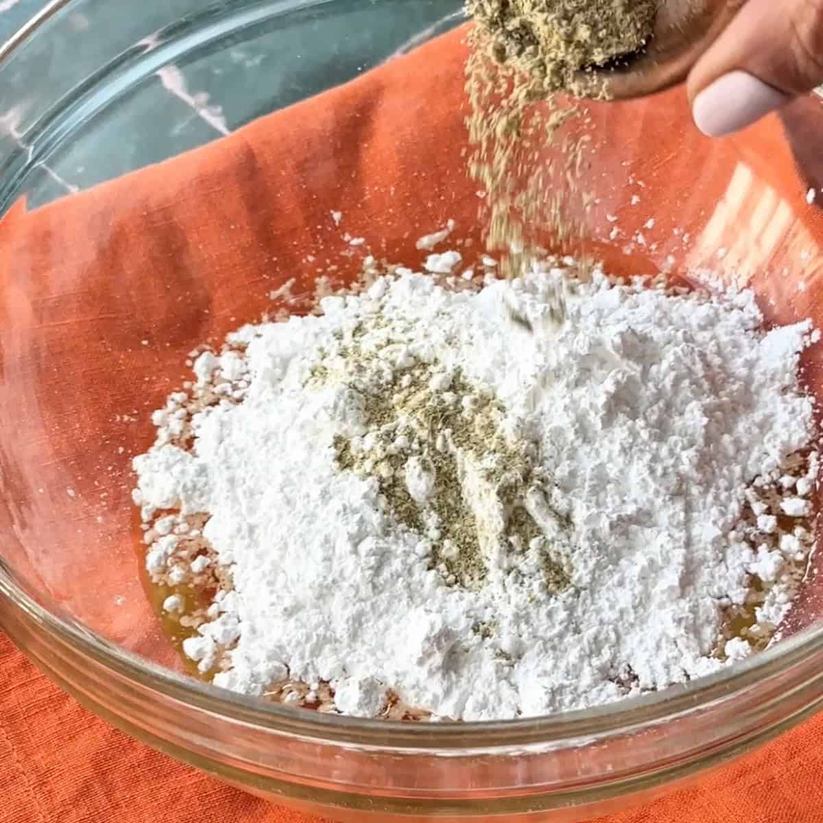 persian chickpea cookies adding ground cardamom to the powdered sugar and canola oil