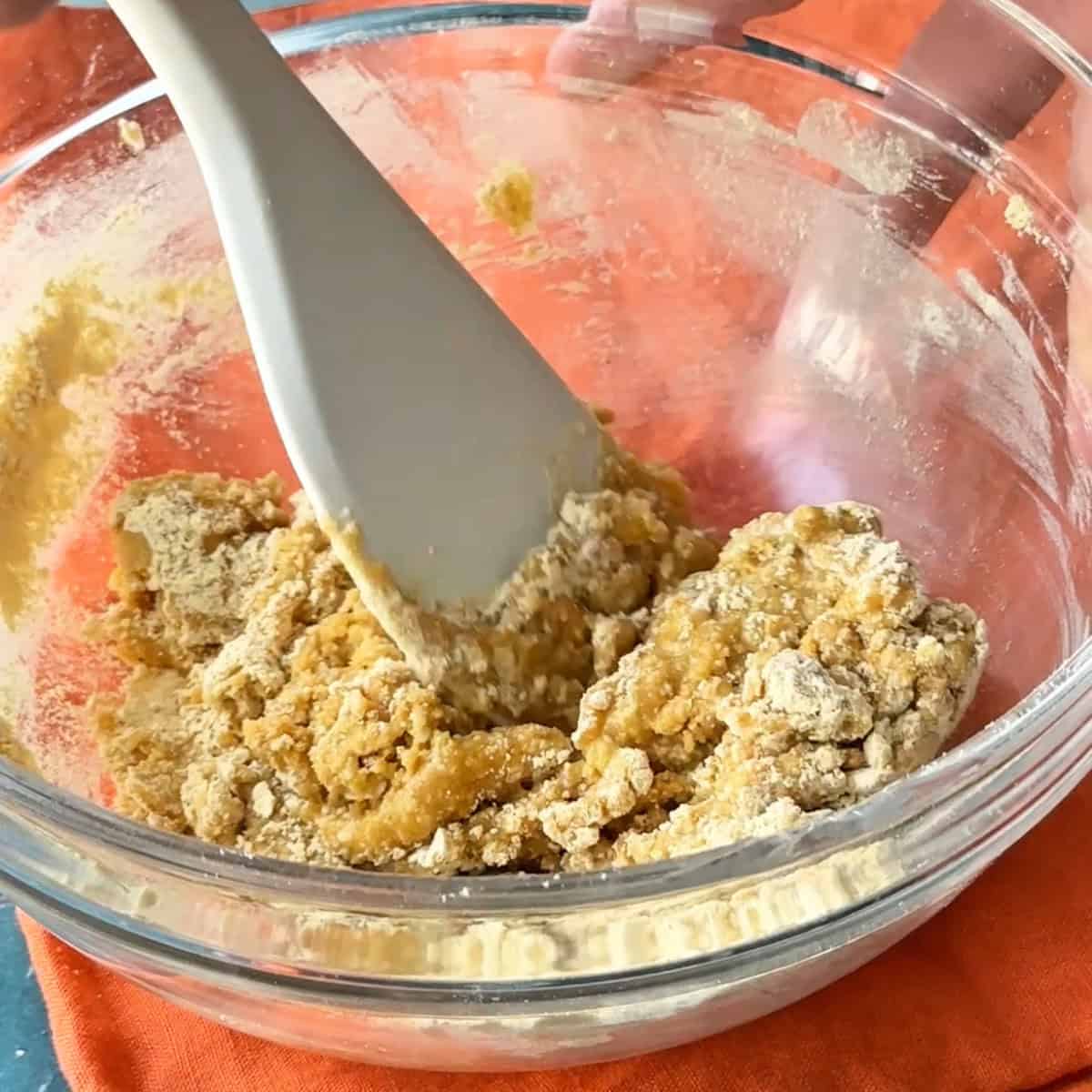 Roasted Chickpea Cookies mixing the ingredients using a spatula