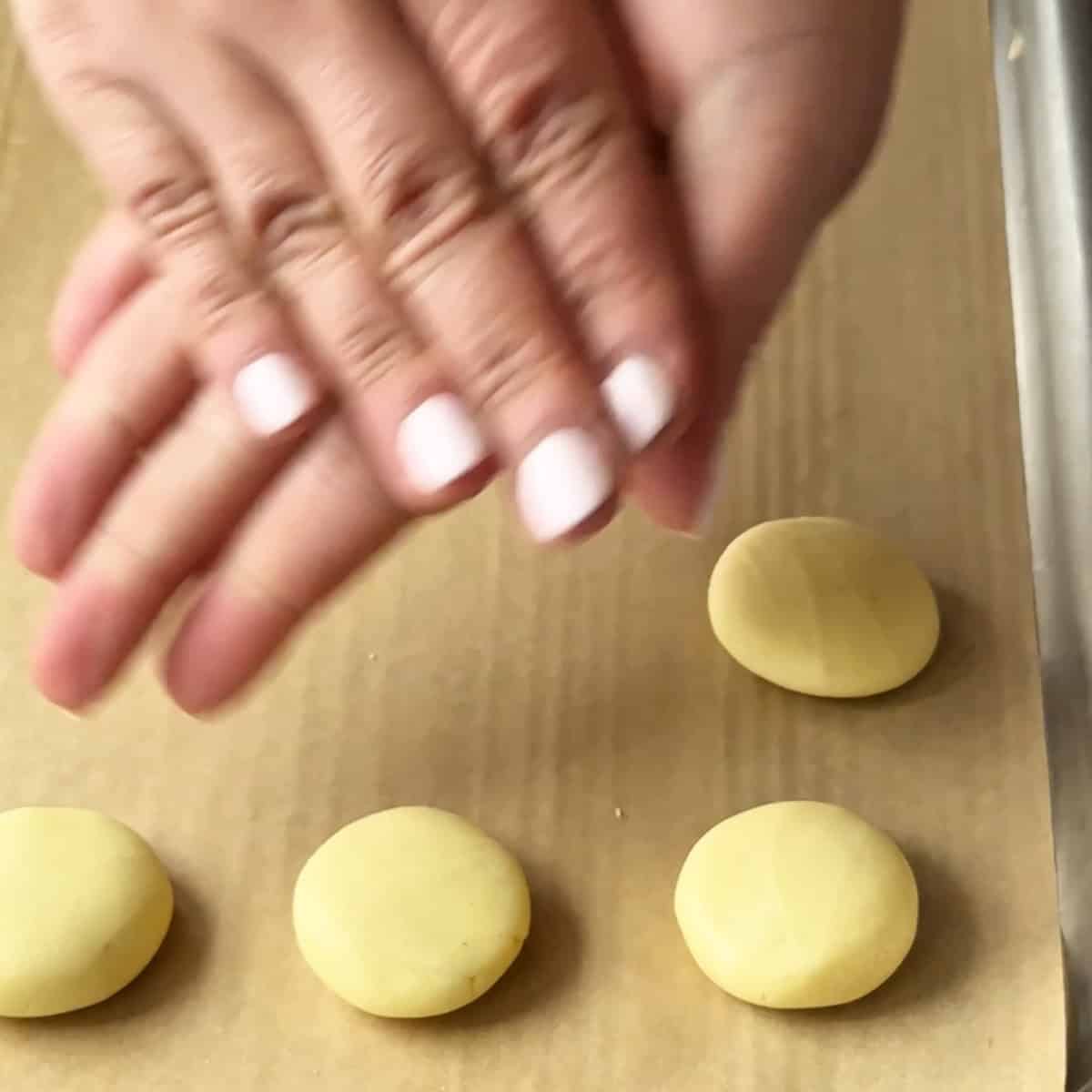 gently flatten the dough between your palms