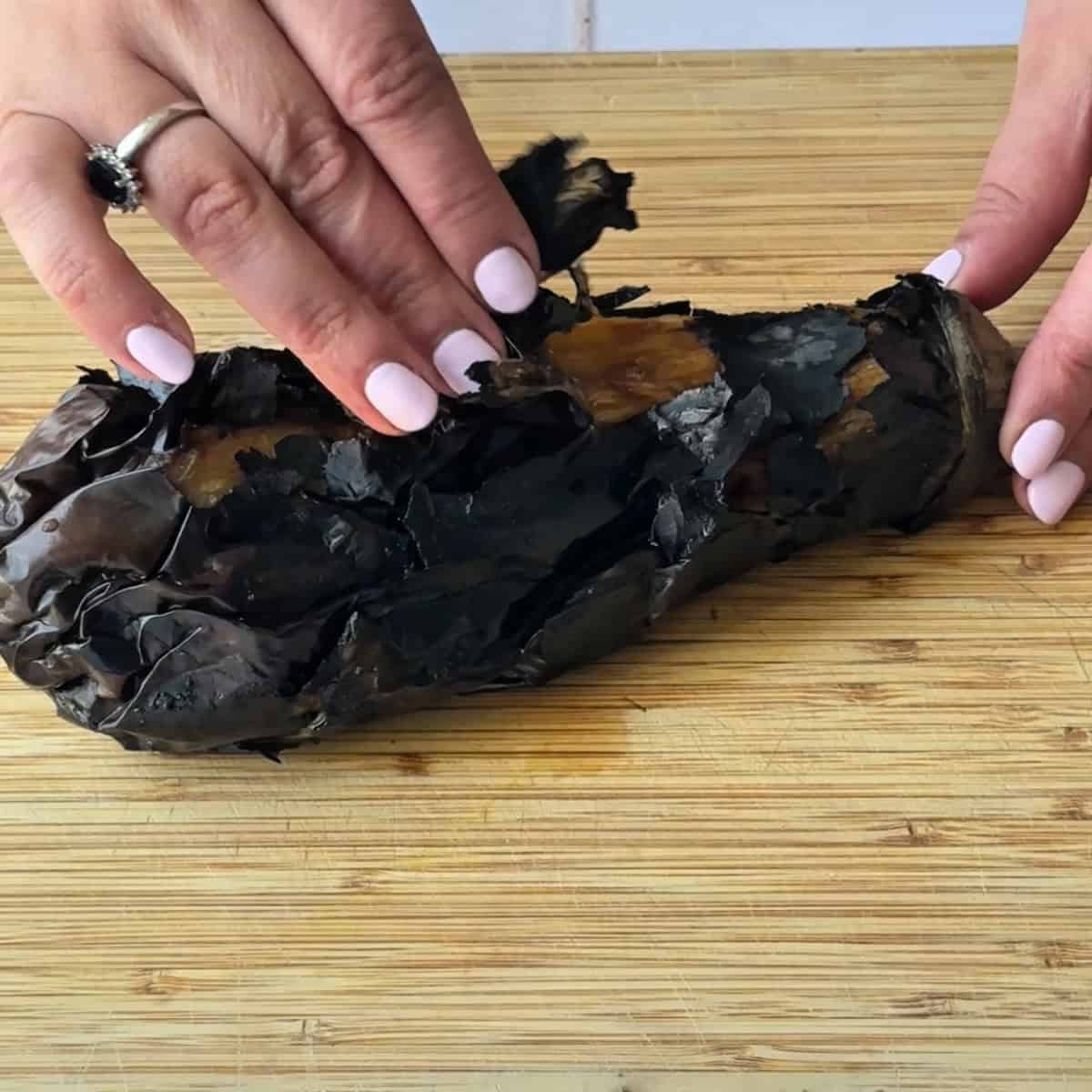 peeling the charred eggplant