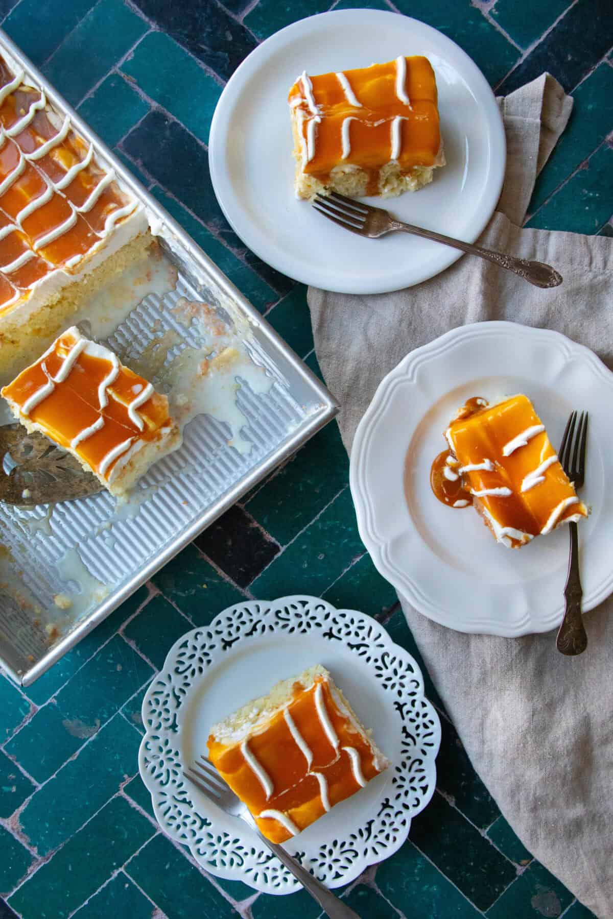 Turkish Milk Cake with Caramel square trilece cake pieces served in white plates