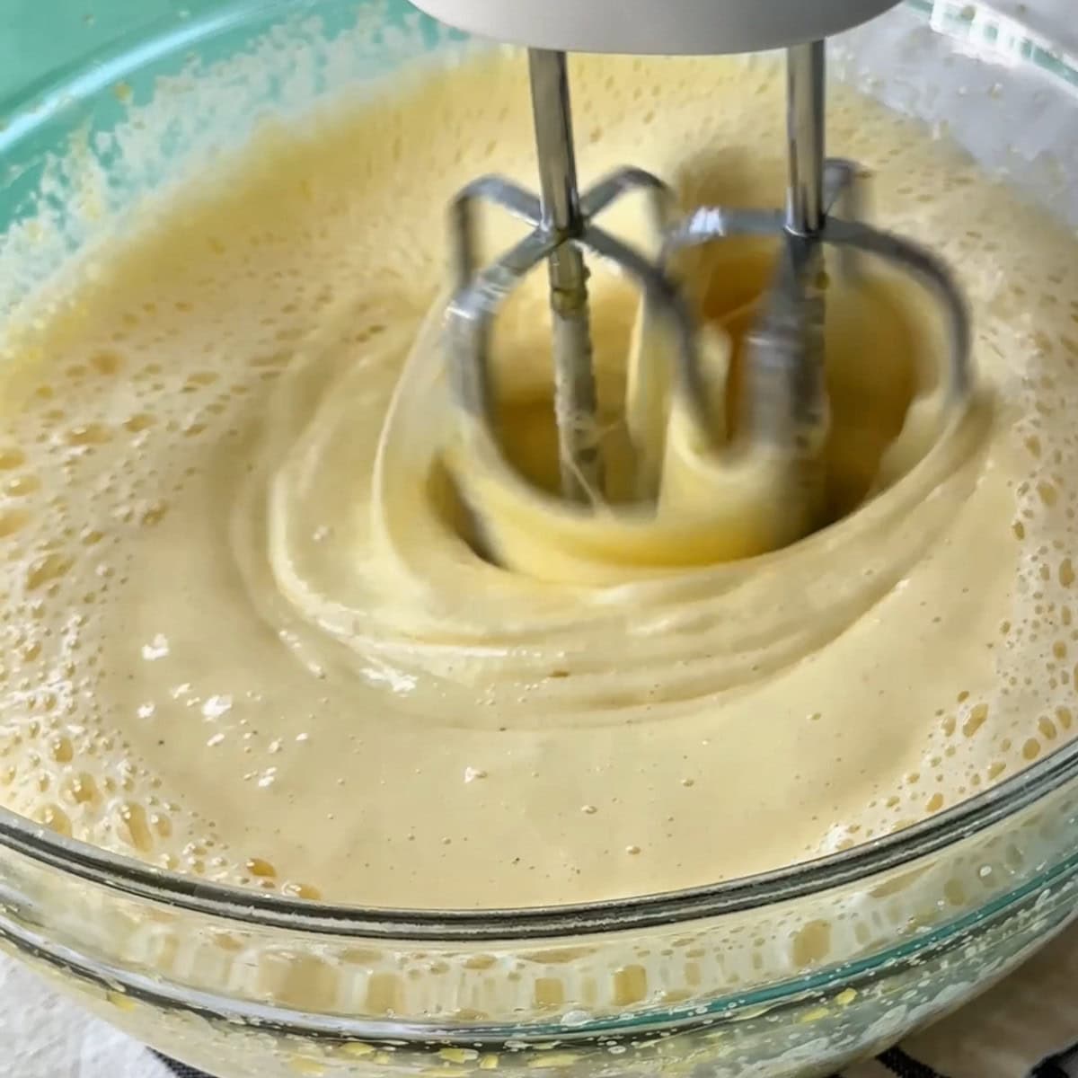 mixing all the wet ingredients of the sponge cake batter