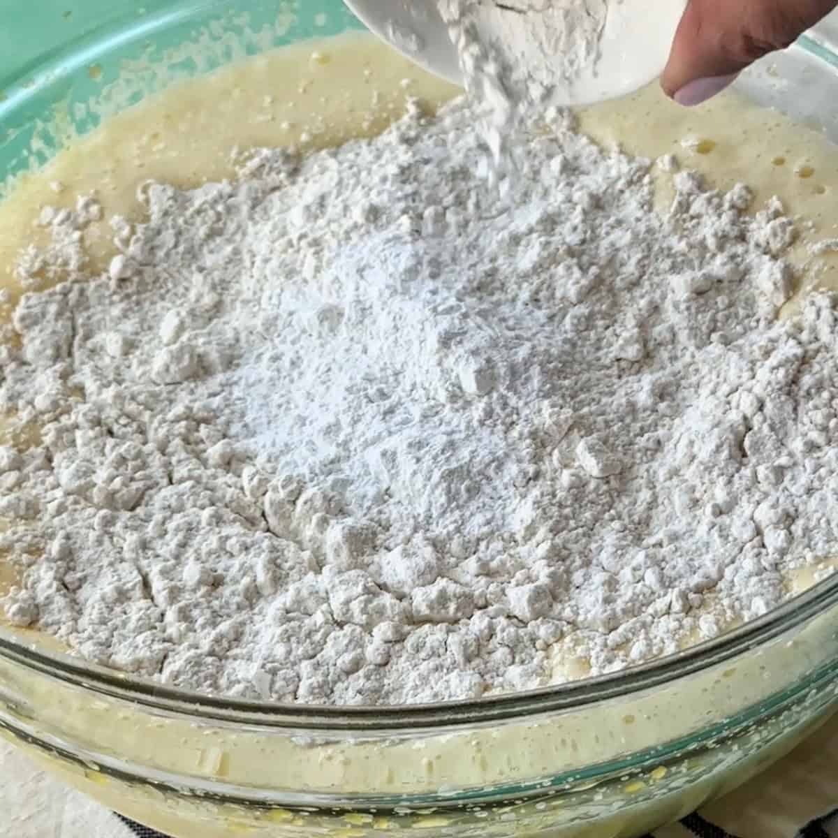 adding baking powder to the cake batter