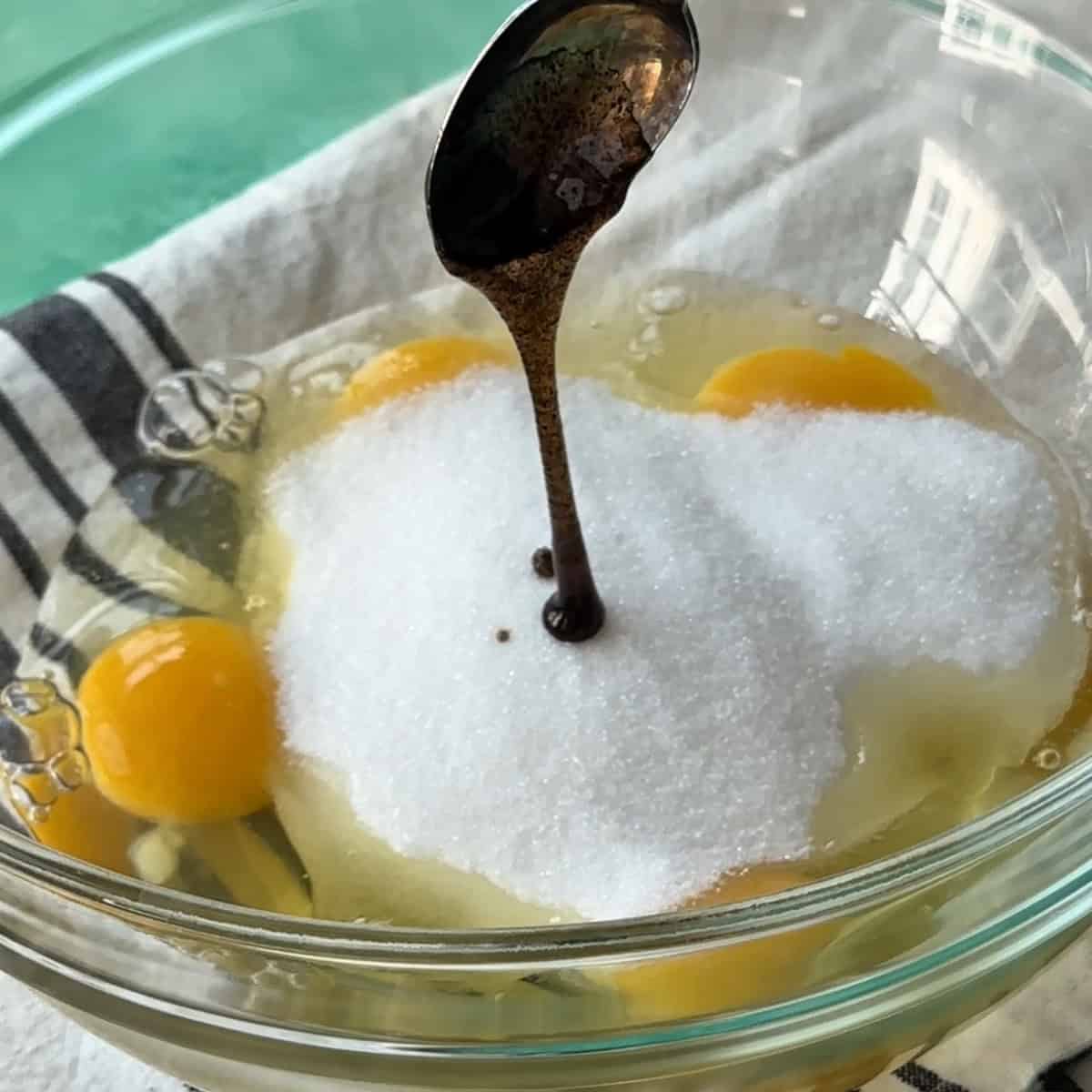 adding vanilla extract to the eggs and sugar before mixing them