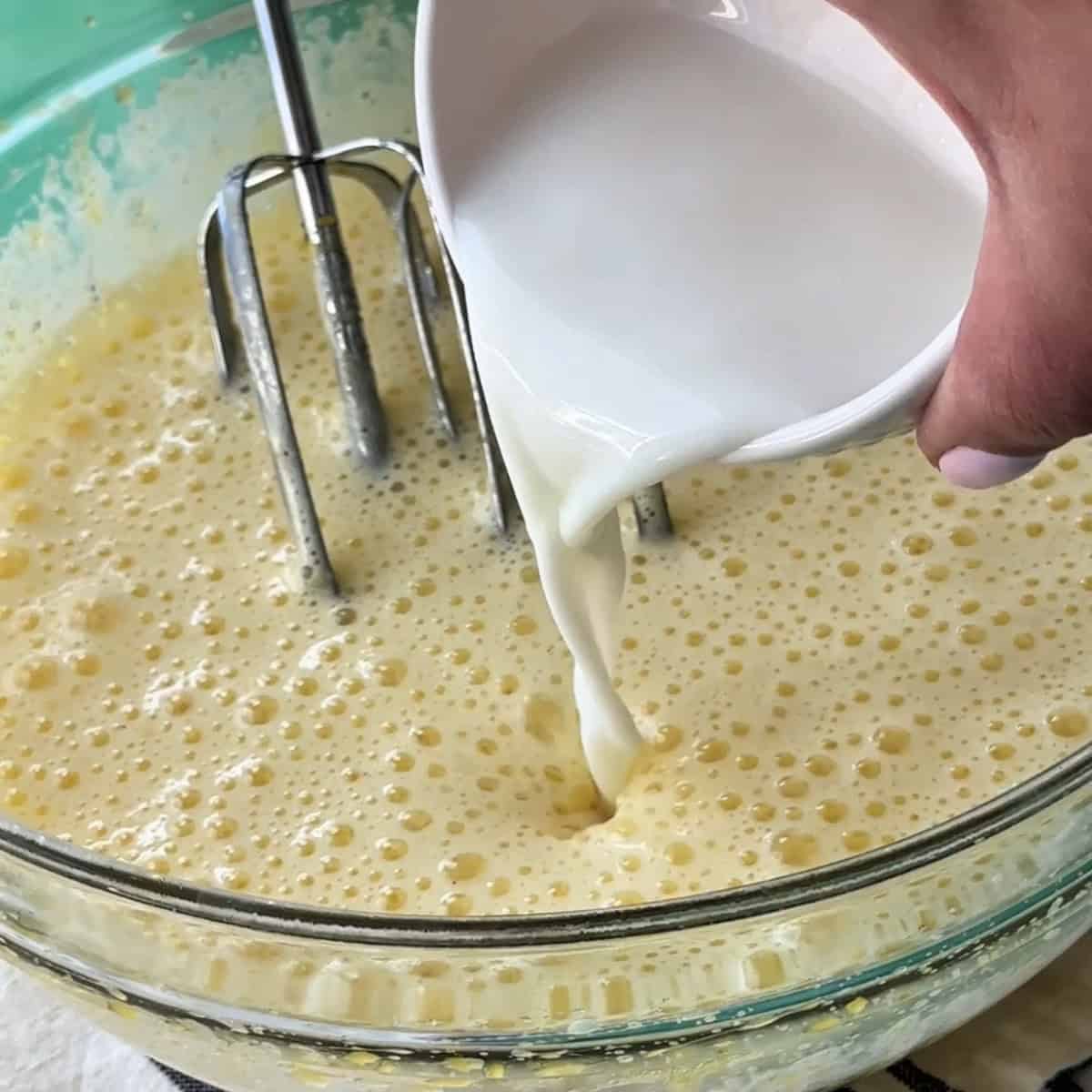 adding milk to the egg mixture