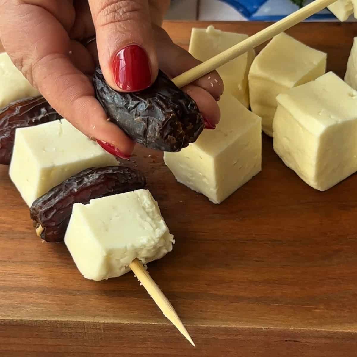 thread the dates on the skewer.