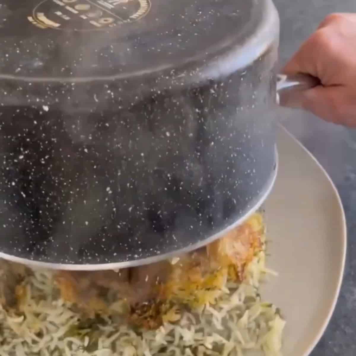 Flip the rice onto a plate.