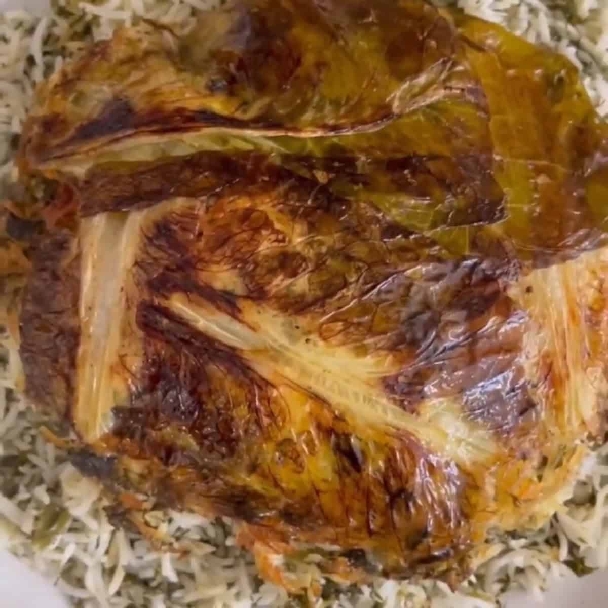 Reveal the tahdig.