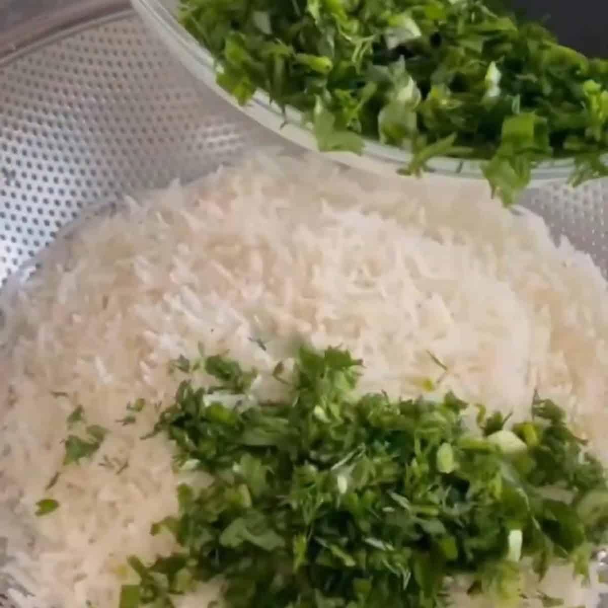 Add the herbs to the rice.