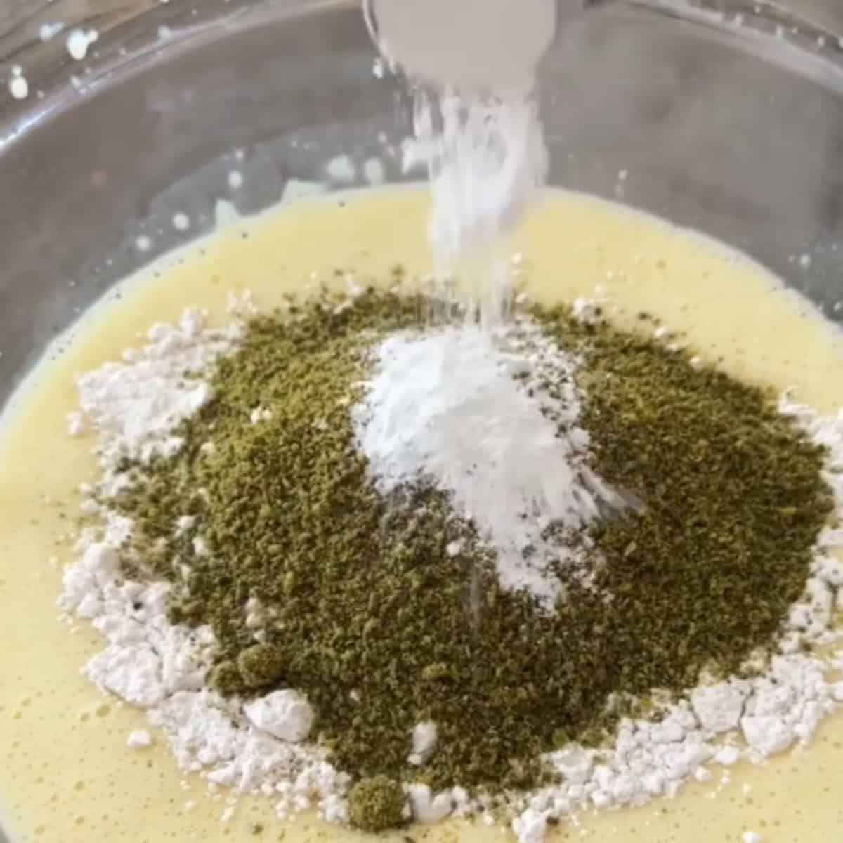 Add in the dry ingredients including all purpose flour and ground pistachio.