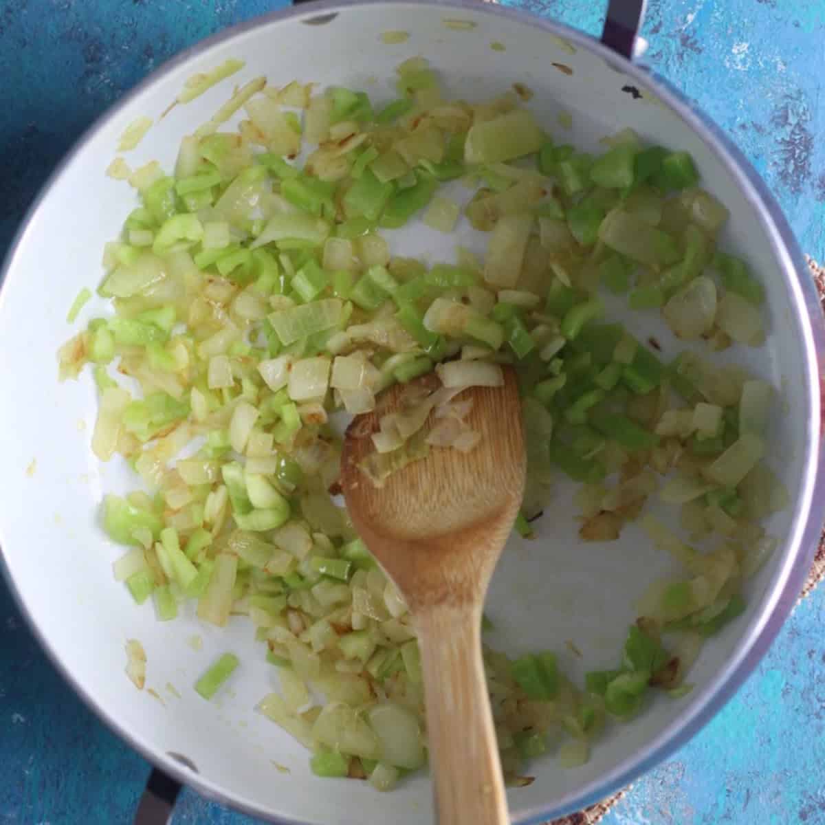 Add in the peppers and cook until soft. 