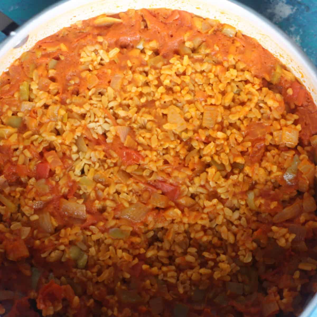 Wrap thelid in a kitchen towel and place on the pot. 