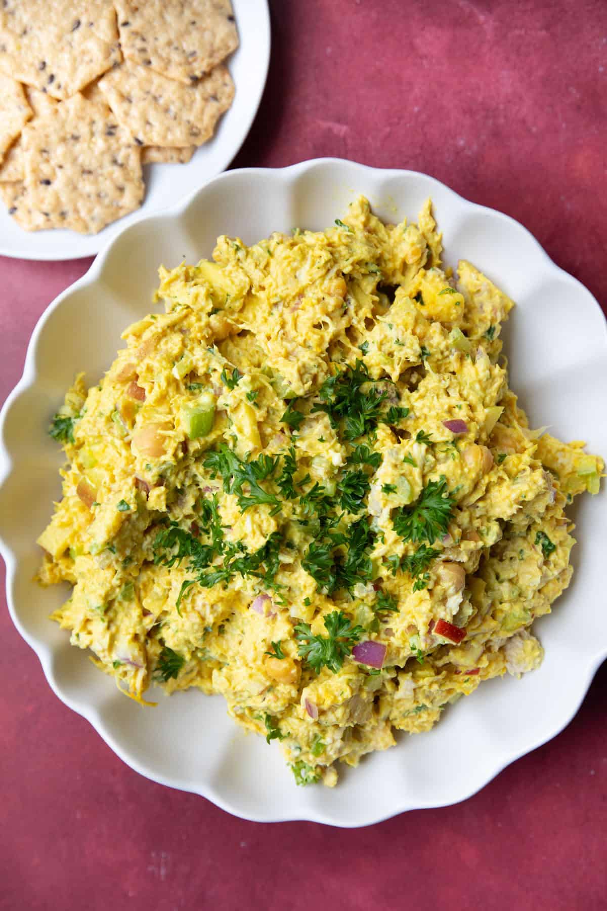 A bowl of chicken chickpea salad with turmeric yogurt dressing.