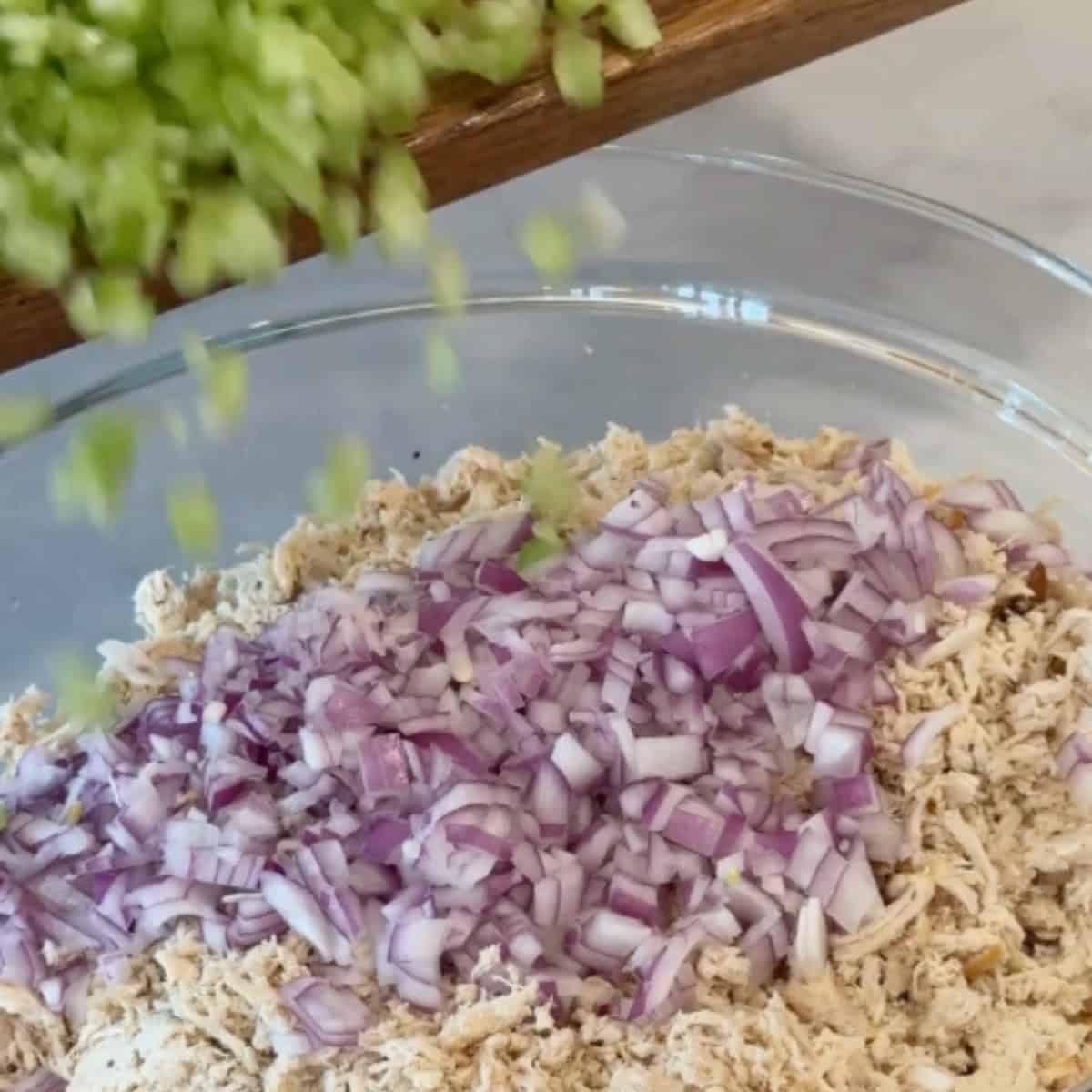 Add the onion and celery to the chicken