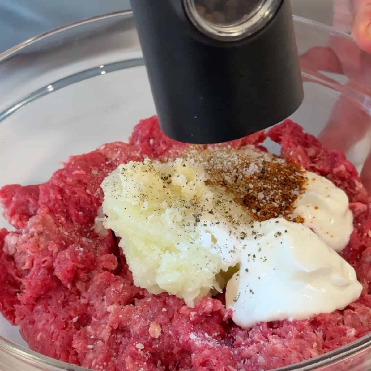 Mix ground beef with yogurt, onion, garlic and spices.