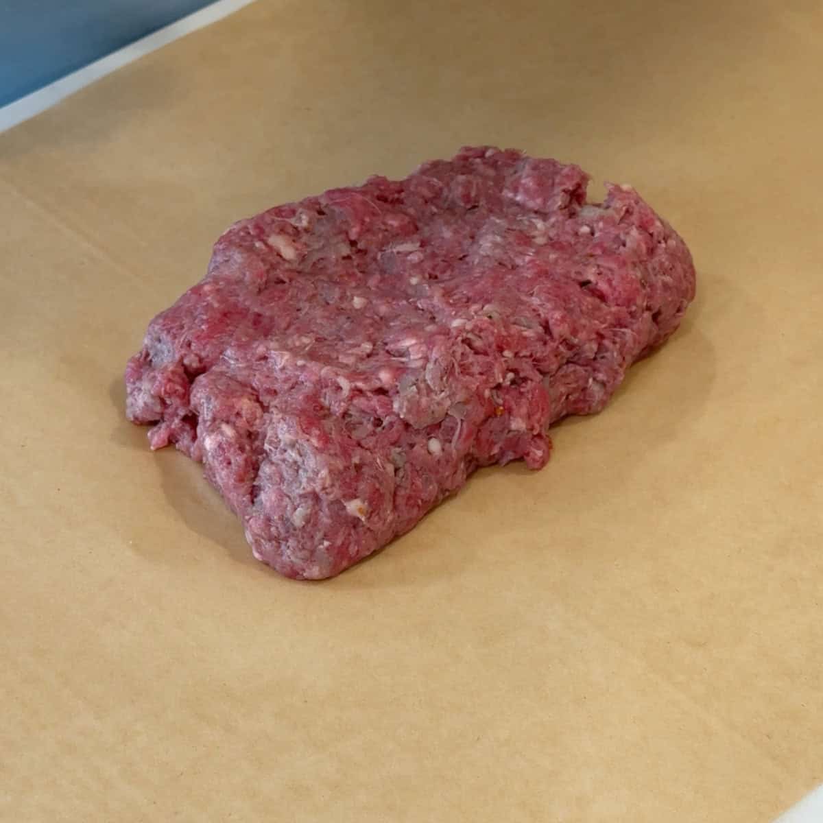 Place a quarter on a parchment paper.
