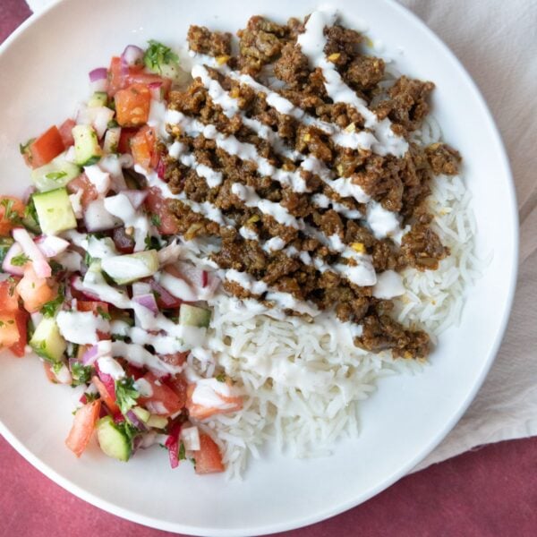 Ground beef bowl with rice and salad.