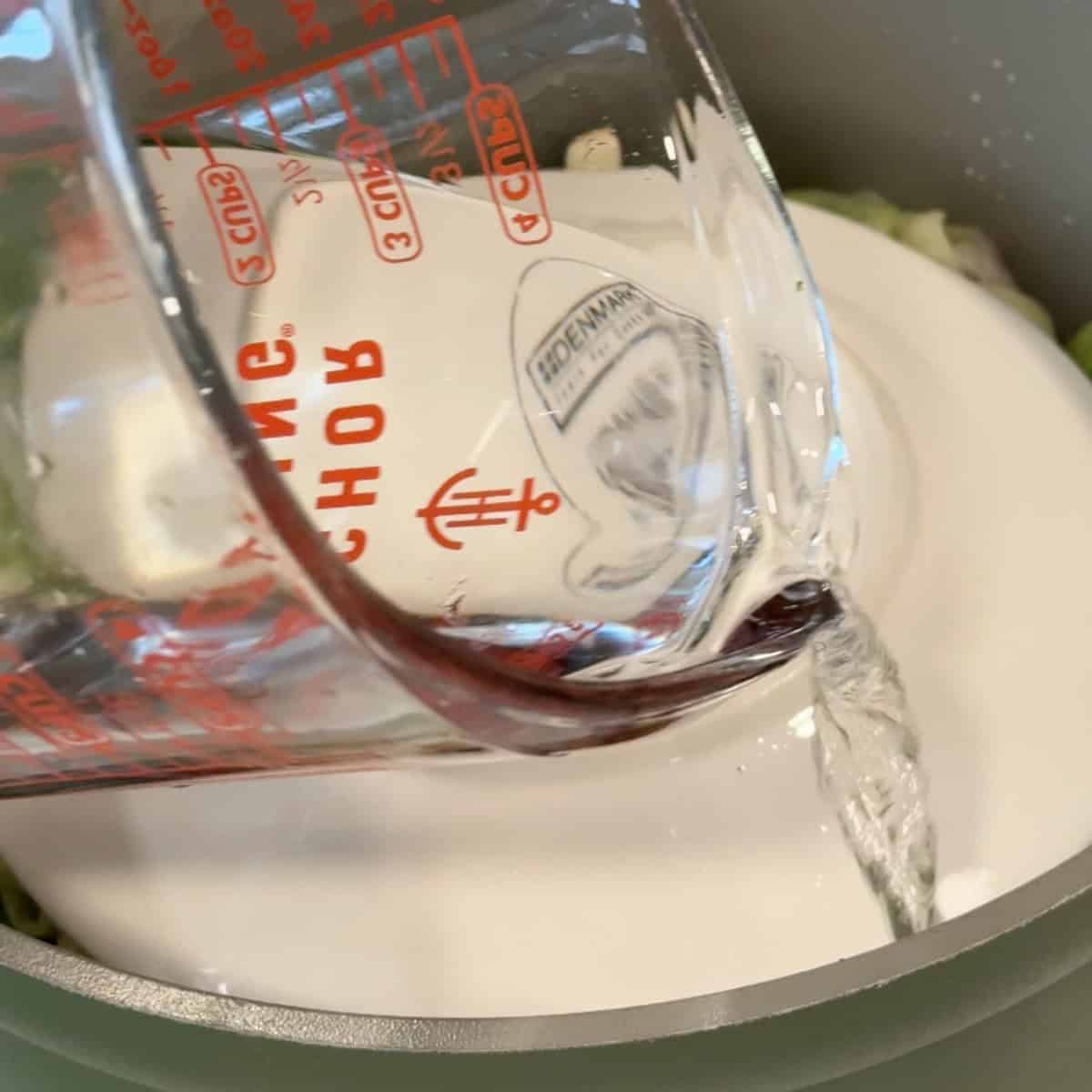 Pour water all over the rolls so it covers them by 1 inch. 